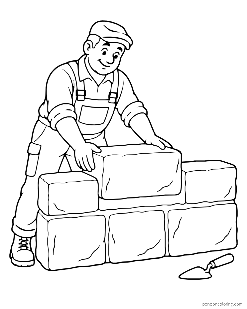 A mason placing a large stone block onto a short wall, with a trowel on the ground nearby.