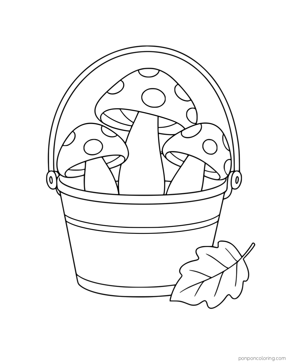 Three spotted mushrooms in a handled pail beside a fallen leaf.