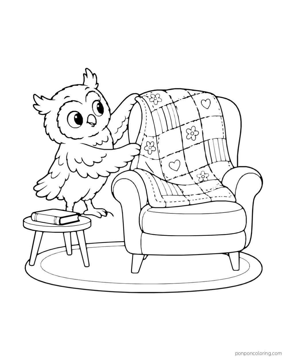 A tufted owl folds a patchwork quilt over a curved reading chair beside a closed book on a low table and an oval rug.