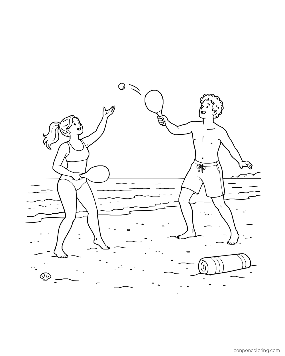 Two beachgoers play paddleball near the shoreline with a rolled towel on the sand.
