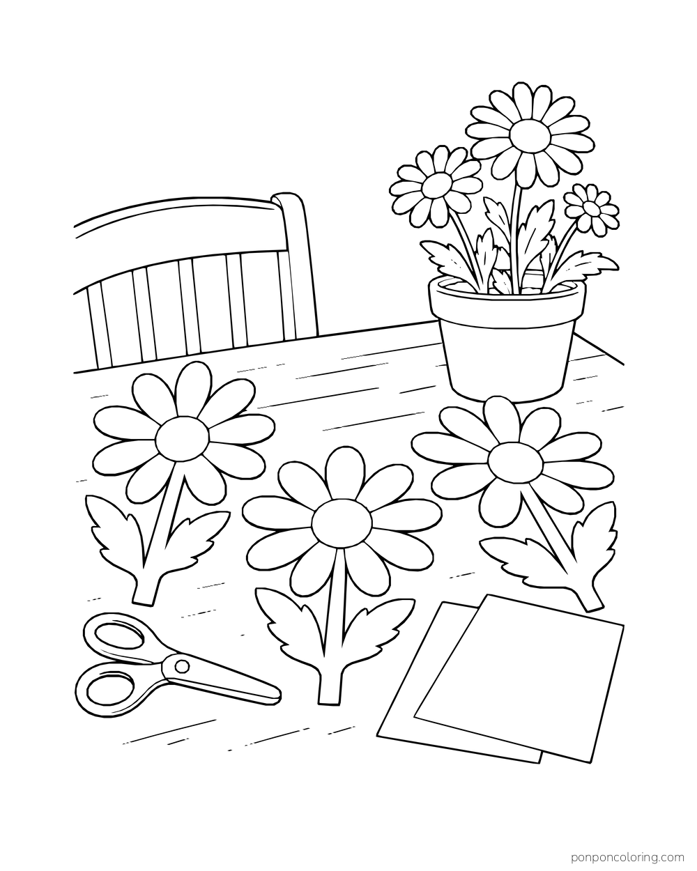 Paper daisies, scissors, and blank craft sheets lie on a worktable beside a potted bloom.