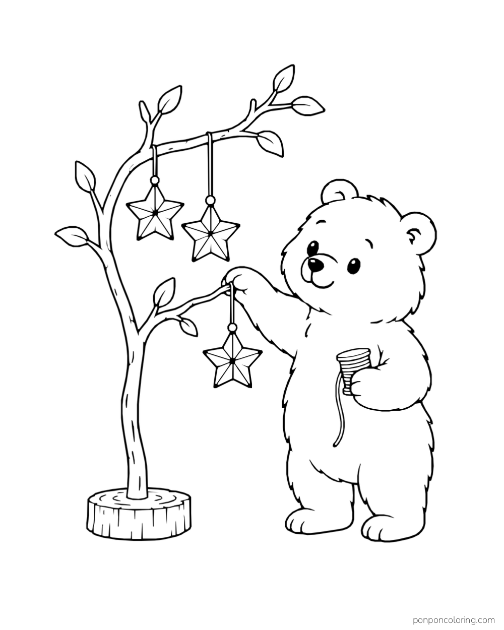 A bear hangs paper stars from a short freestanding branch while holding a spool of string.