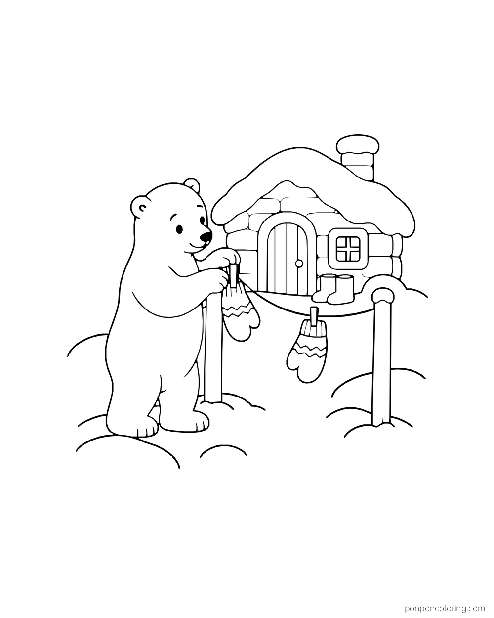 A polar bear cub reaches to hang a mitten beside a small snowy cabin doorway.