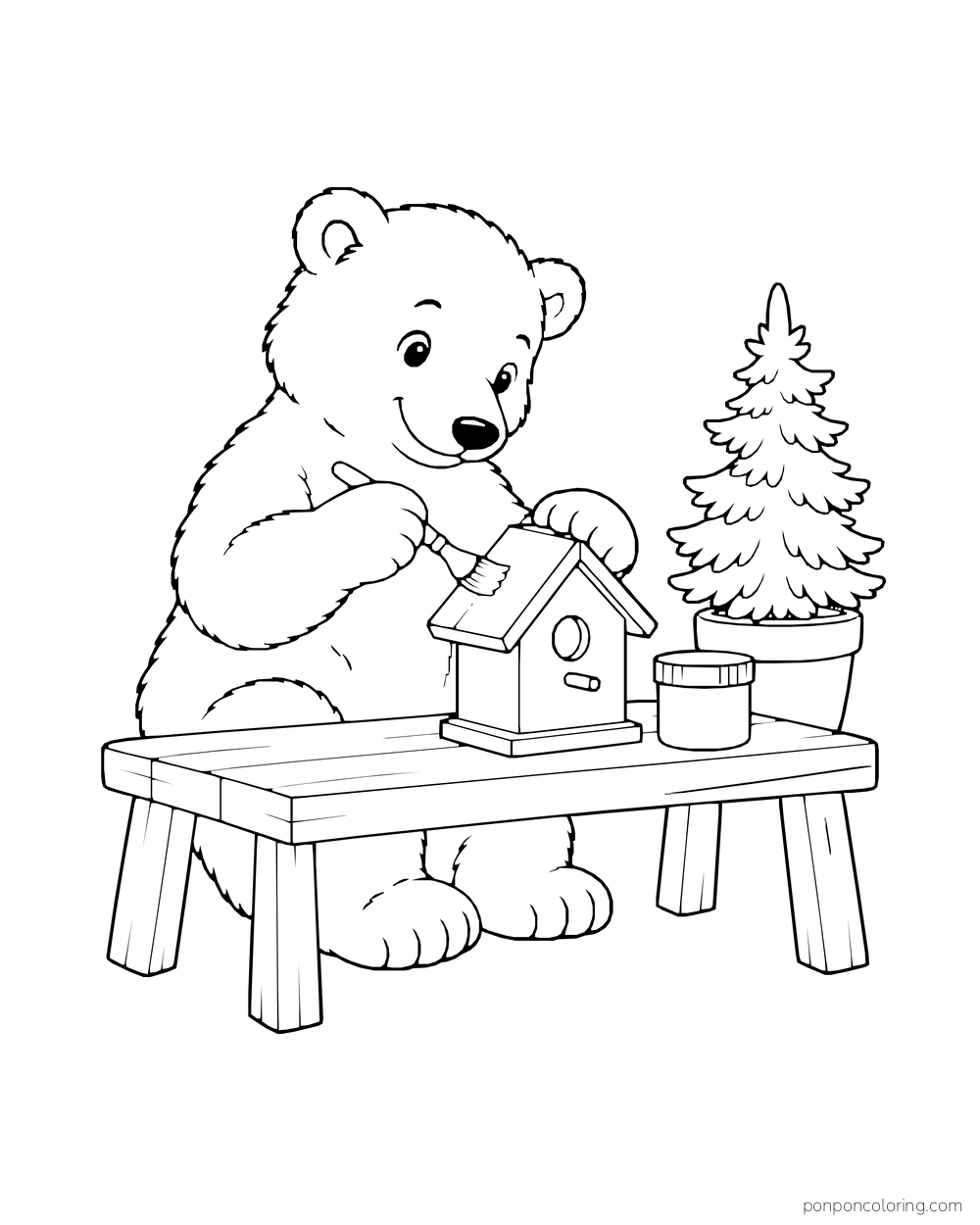 A polar bear cub paints the roof of a birdhouse on a workbench.