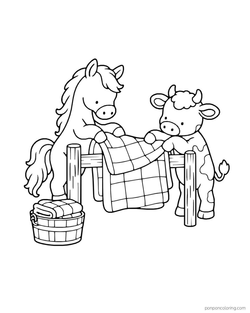 A pony and calf hold a checked quilt over a fence rail beside a basket of folded fabric.