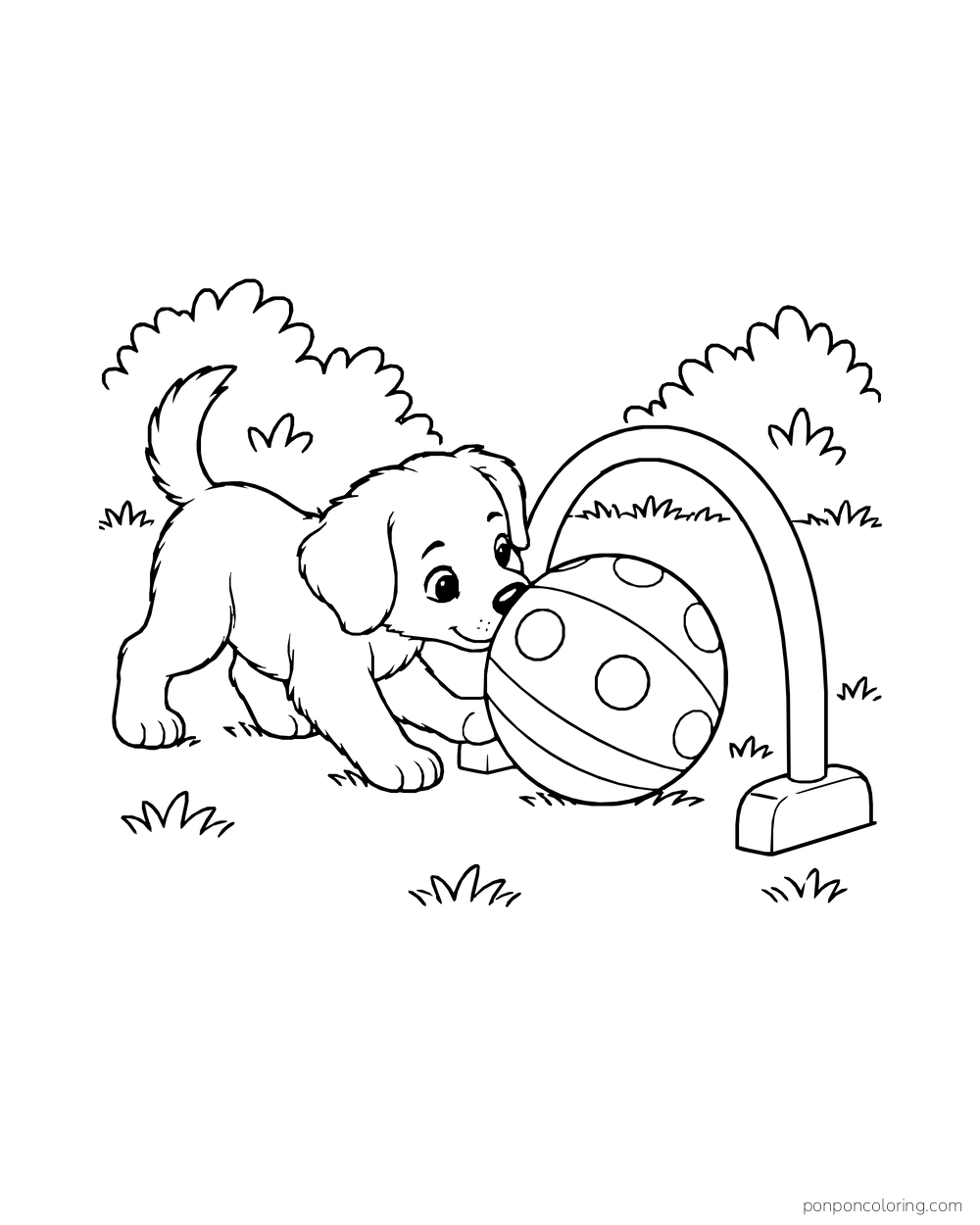 A puppy pushes a patterned ball through a low play hoop.