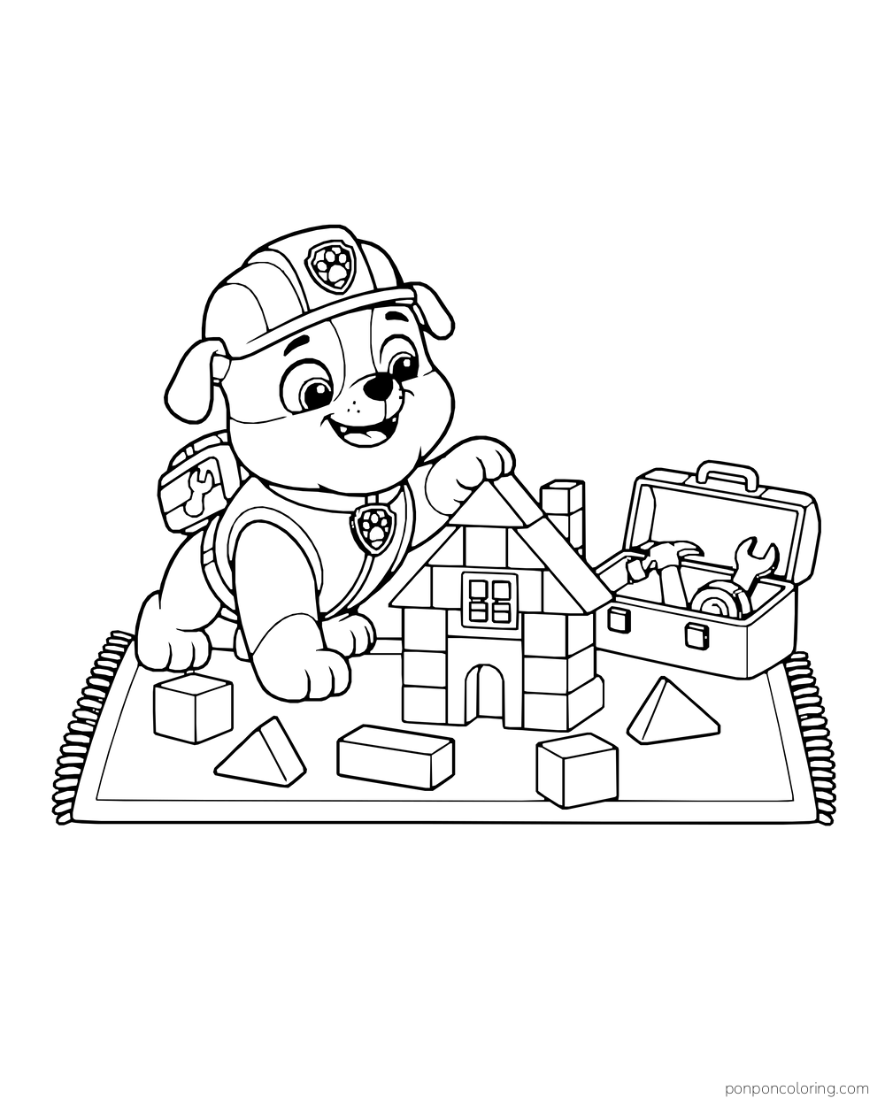 Rubble stacks toy blocks into a house beside an open toolbox on a rectangular rug.