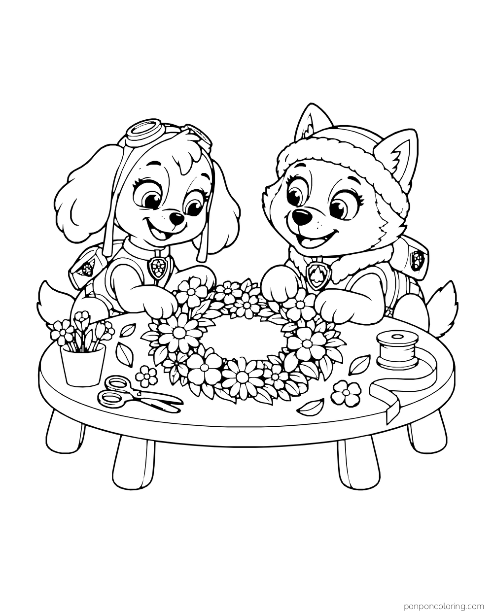 Skye and Everest make a flower wreath at a low table with scissors and ribbon.