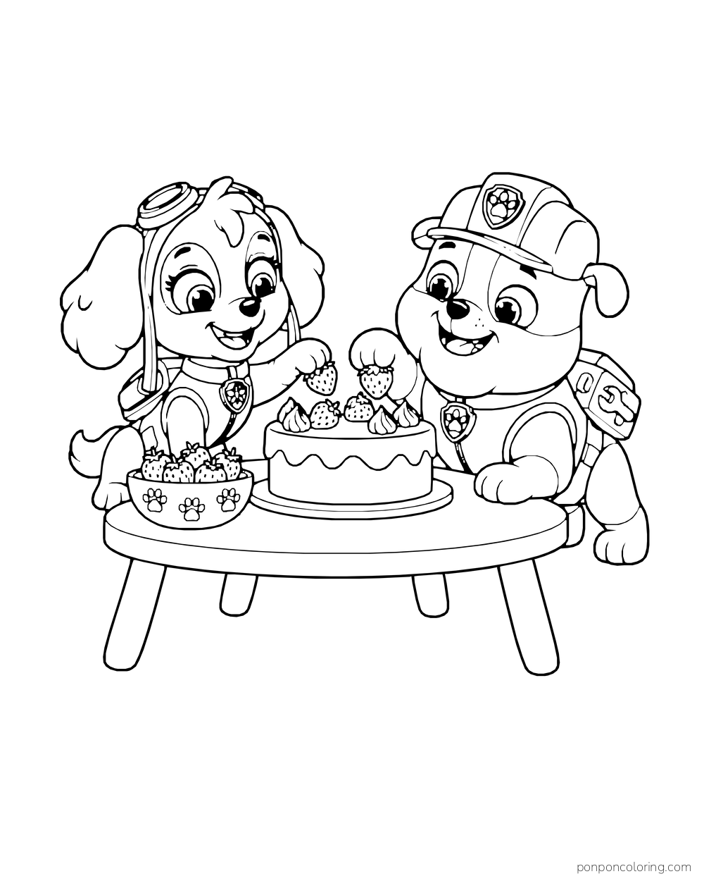 Skye and Rubble decorate a round cake with strawberries at a low table.