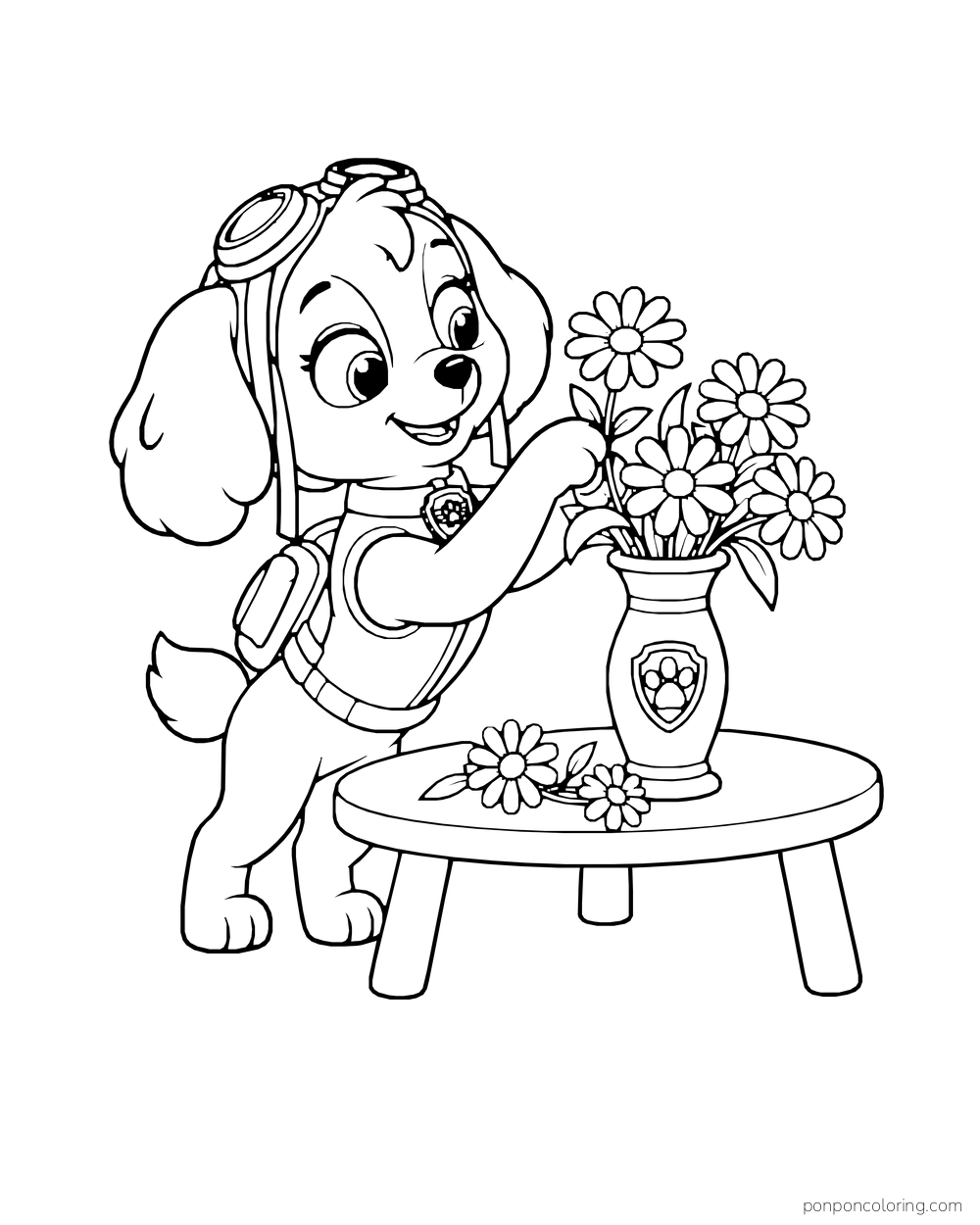 Skye arranges daisies in a vase on a small round table.