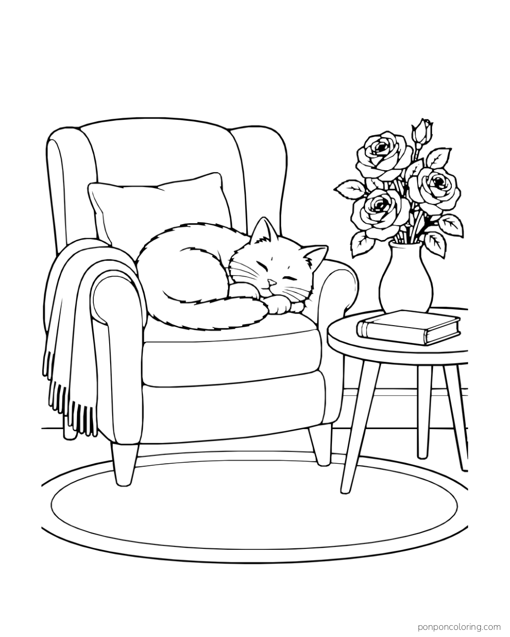 Cat asleep on a soft chair beside a table with a rose vase and closed book.