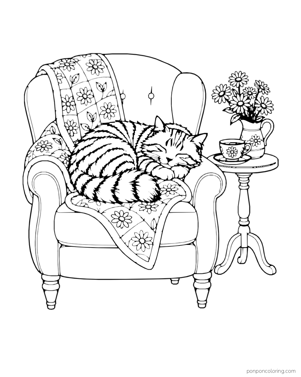 A striped cat sleeps in a rounded armchair with a floral quilt beside a teacup and pitcher of daisies.