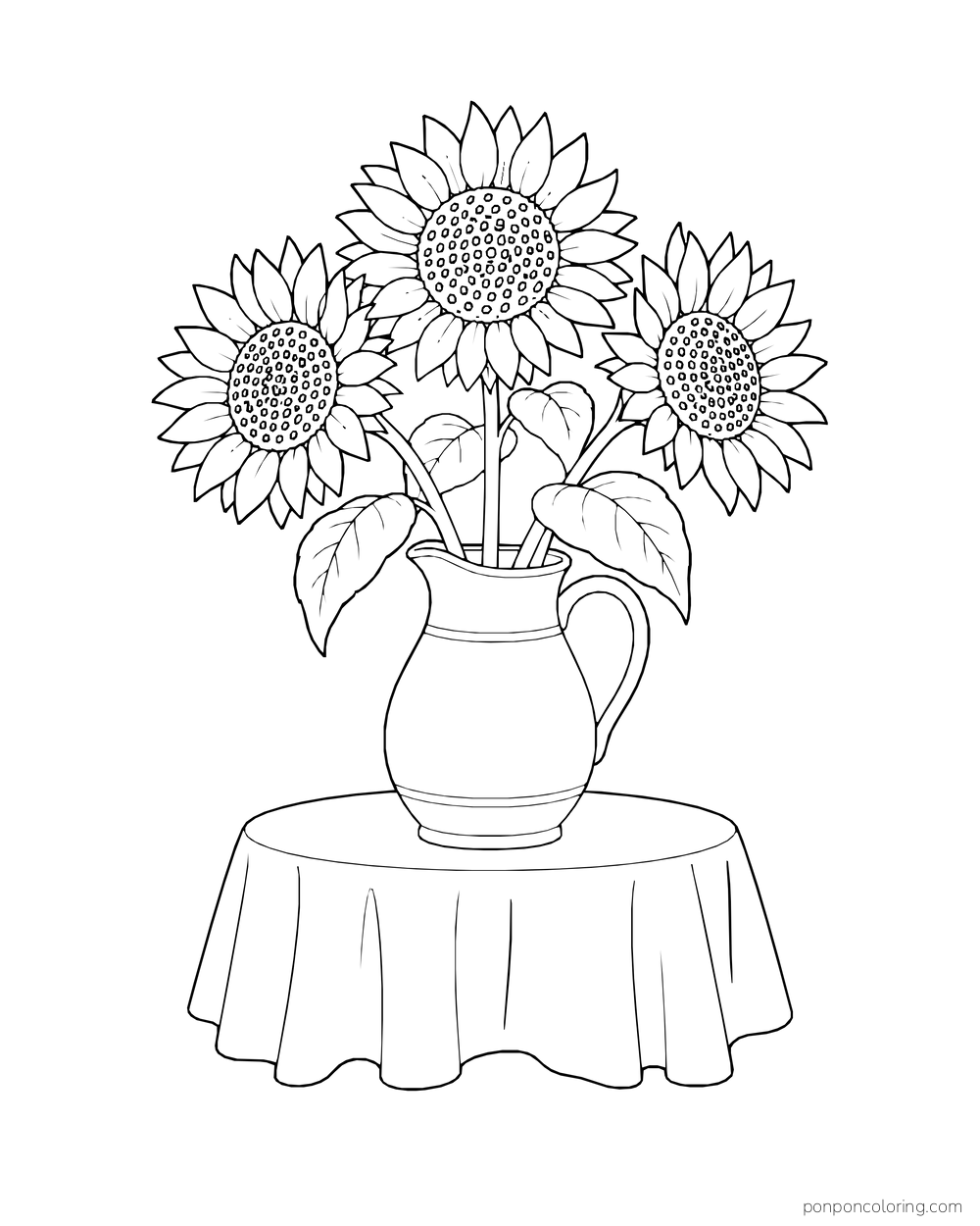 Three sunflowers in a pitcher on a cloth-covered round table.
