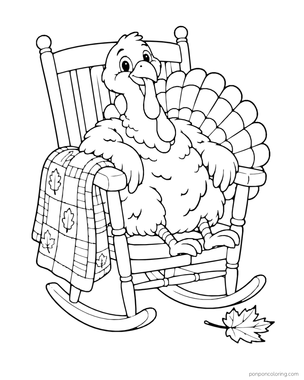 A turkey rests in a rocking chair with a leaf-patterned quilt and a fallen leaf.