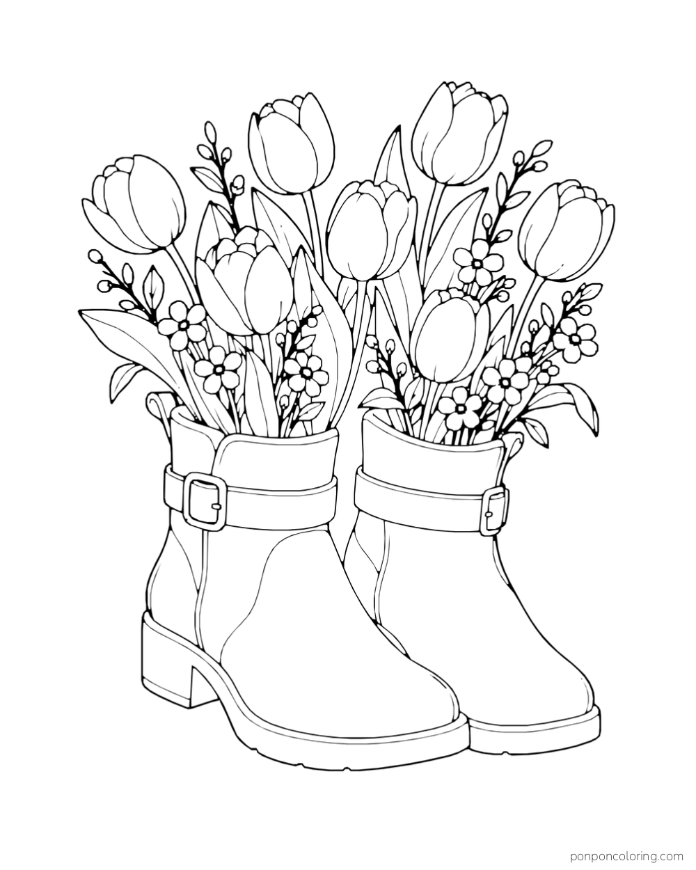Two buckled rain boots hold tulips, small flowers, and leafy stems.