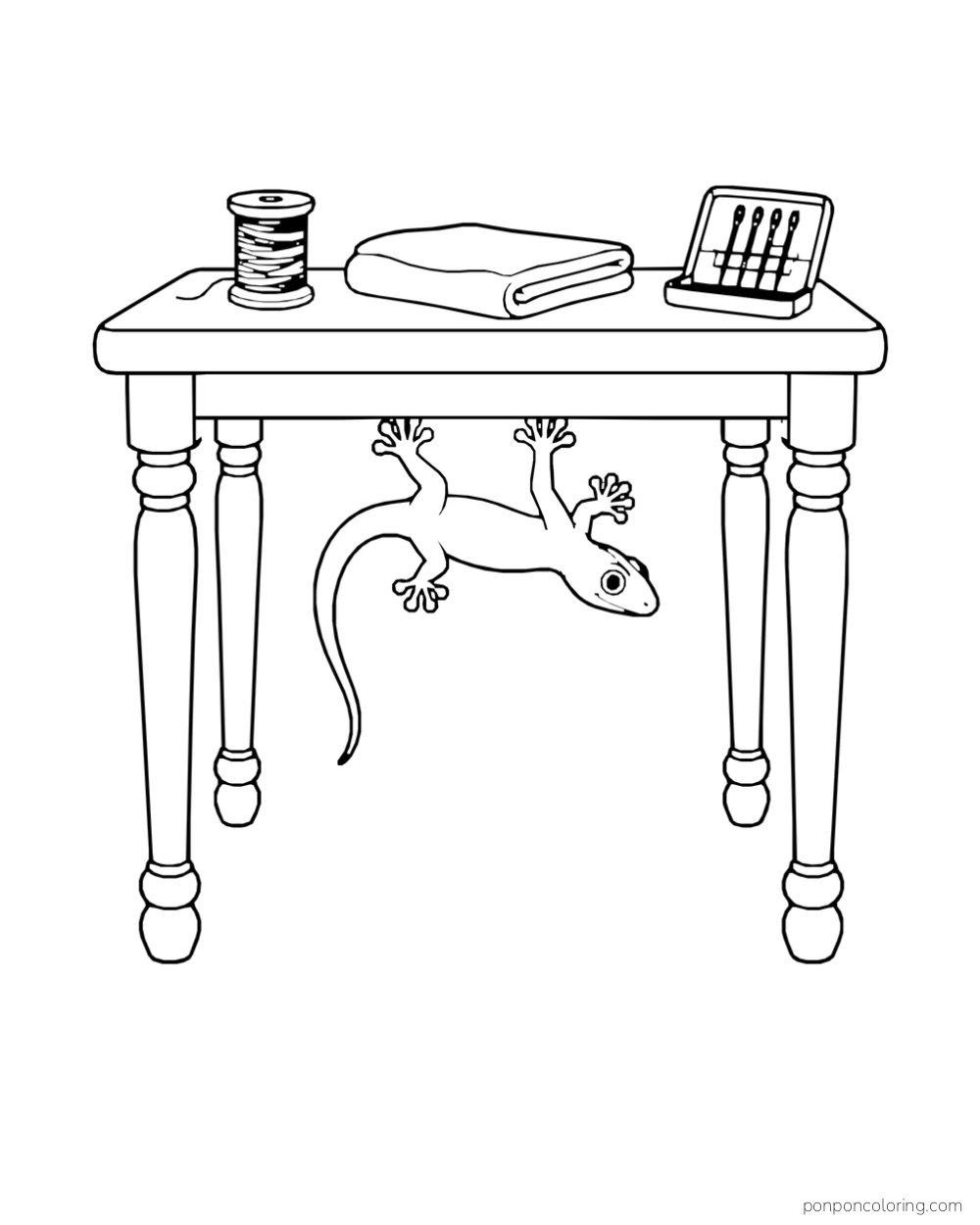 A gecko clings upside down beneath a small table holding a thread spool, folded cloth, and needle case.