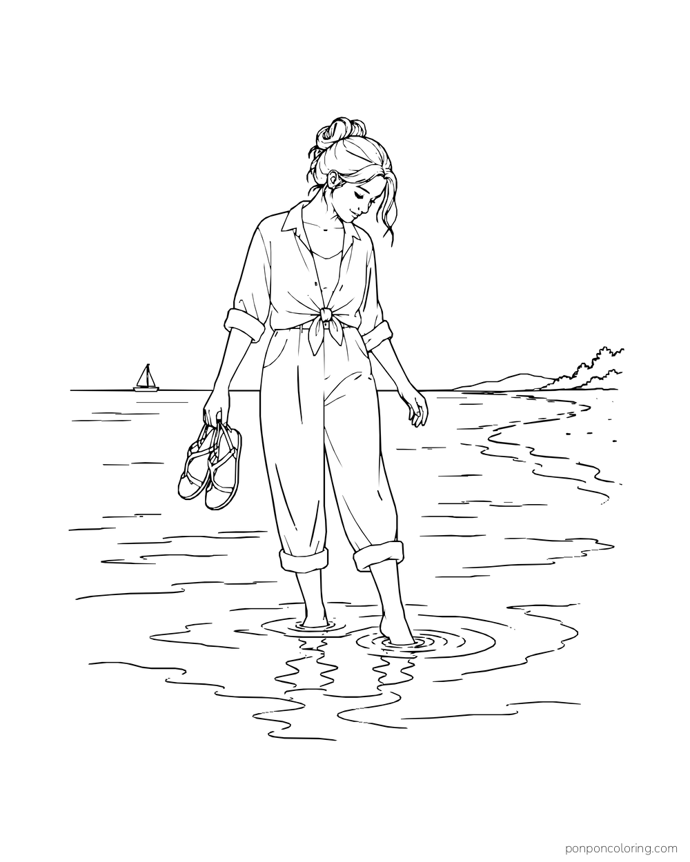 A woman holds her sandals in one hand while walking through shallow water.