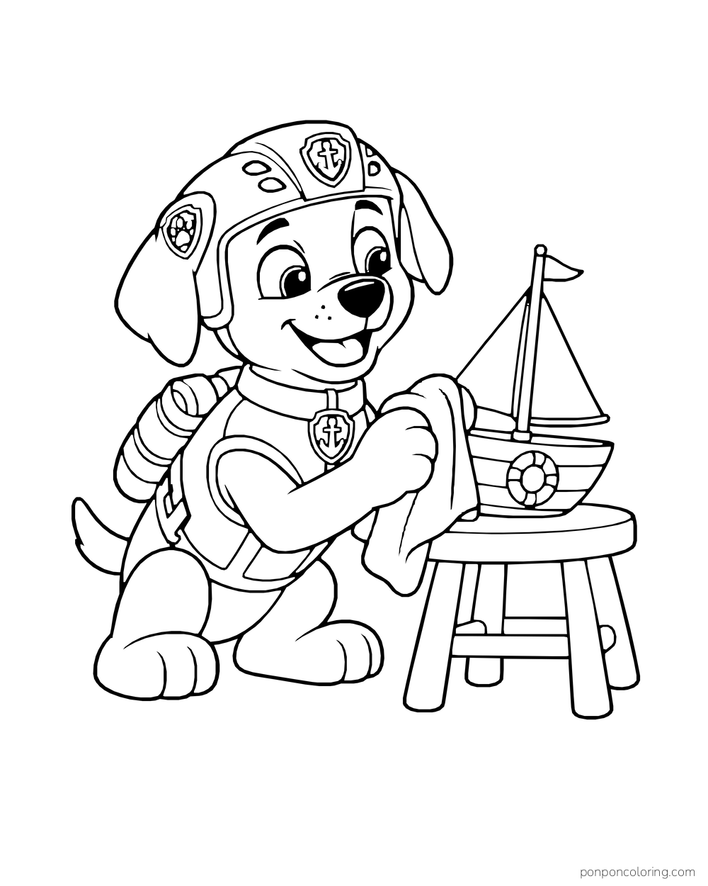 Zuma wipes a model sailboat on a small round stool.